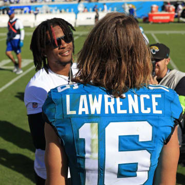 Jacksonville Jaguars quarterback Trevor Lawrence (16) greets Indianapolis Colts quarterback Anthony Richardson (5) after the game an NFL football matchup Sunday, Oct. 15, 2023 at EverBank Stadium in Jacksonville, Fla. The Jacksonville Jaguars defeated the Indianapolis Colts 37-20. Richardson did not play because of a shoulder injury. [Corey Perrine/Florida Times-Union]