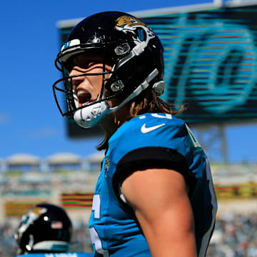 Jacksonville Jaguars quarterback Trevor Lawrence (16) celebrates his pass for a touchdown score to wide receiver Christian Kirk (13) during the second quarter of an NFL football matchup Sunday, Oct. 15, 2023 at EverBank Stadium in Jacksonville, Fla. The Jacksonville Jaguars defeated the Indianapolis Colts 37-20. [Corey Perrine/Florida Times-Union]