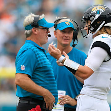 Jacksonville Jaguars quarterback Trevor Lawrence (16) talks with head coach Doug Pederson, left, as quarterbacks coach Mike McCoy looks on during the third quarter of an NFL football matchup Sunday, Sept. 15, 2024 at EverBank Stadium in Jacksonville, Fla. The Browns defeated the Jaguars 18-13. [Corey Perrine/Florida Times-Union]