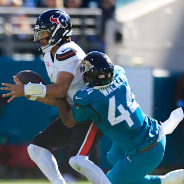 Jacksonville Jaguars defensive end Travon Walker (44) sacks Houston Texans quarterback C.J. Stroud (7) during the first quarter of an NFL football matchup Sunday, Dec. 1, 2024 at EverBank Stadium in Jacksonville, Fla. [Corey Perrine/Florida Times-Union]