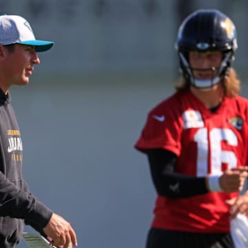 Jacksonville Jaguars offensive coordinator Grant Udinski talks near quarterback Trevor Lawrence (16) during the second mandatory minicamp at Miller Electric Center Wednesday, June 11, 2025 in Jacksonville, Fla.