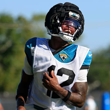 Jacksonville Jaguars wide receiver Travis Hunter (12) reacts during practices as cornerback Jarrian Jones (22) looks on during an NFL training camp session at the Miller Electric Center, Wednesday, Aug. 6, 2025, in Jacksonville, Fla. [Corey Perrine/Florida Times-Union]