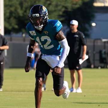 Jacksonville Jaguars wide receiver Travis Hunter (12) runs a route as quarterback Trevor Lawrence (16) looks to pass during an NFL training camp session at the Miller Electric Center, Tuesday, July 29, 2025, in Jacksonville, Fla. [Corey Perrine/Florida Times-Union]