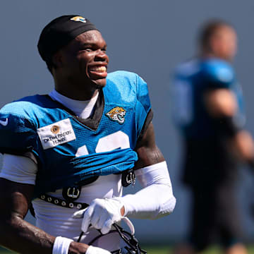 Jacksonville Jaguars wide receiver Travis Hunter (12) smiles as he walks off the field after an NFL training camp session at the Miller Electric Center, Tuesday, July 29, 2025, in Jacksonville, Fla. [Corey Perrine/Florida Times-Union]