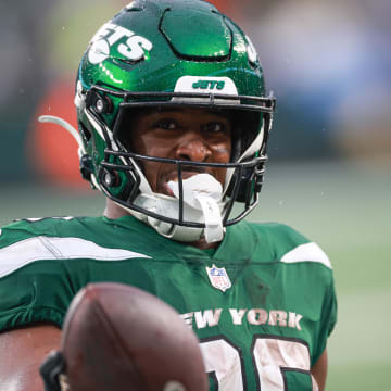 Dec 10, 2023; East Rutherford, New Jersey, USA; New York Jets running back Breece Hall (20) celebrates after a touchdown reception during the second half against the Houston Texans at MetLife Stadium. 