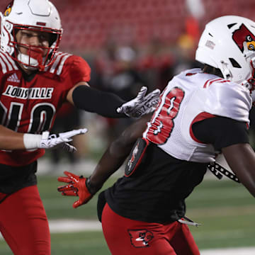 Louisville’s Jaleel Skinner catches the ball and scores a touchdown on Friday night at L&N Stadium