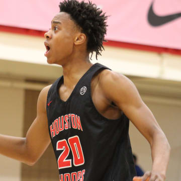 Tre Johnson (20 reacts to a play during an AAU basketball game July 4, 2023, at the Nike EYBL Peach Jam in North Augusta, S.C. A Kentucky target, Johnson is considered one of the shooting guards in the Class of 2024.