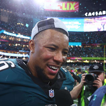 Philadelphia Eagles running back Saquon Barkley (26) is interviewed on field after defeating the Kansas City Chiefs in Super Bowl LIX.