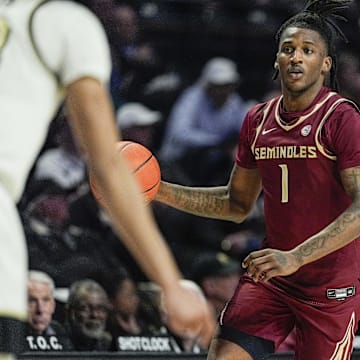 Feb 12, 2025; Winston-Salem, North Carolina, USA;  Florida State Seminoles guard Jamir Watkins (1) brings the ball up court against the Wake Forest Demon Deacons during the second half at Lawrence Joel Veterans Memorial Coliseum. Mandatory Credit: Jim Dedmon-Imagn Images