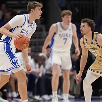 Duke Blue Devils forward Cooper Flagg looks over the Georgia Tech Yellow Jackets defense during the first half at Spectrum Center. 
