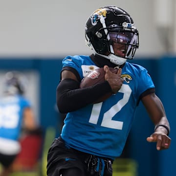 Jacksonville Jaguars wide receiver Travis Hunter runs the ball during OTAs.
