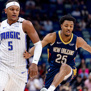 Orlando Magic forward Paolo Banchero (5) dribbles around New Orleans Pelicans guard Trey Murphy III (25) during the first half at Smoothie King Center.
