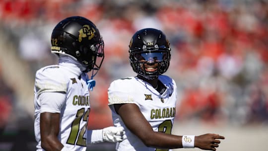 Oct 19, 2024; Tucson, Arizona, USA; Colorado Buffalos quarterback Shedeur Sanders (2) with wide receiver Travis Hunter (12) against the Arizona Wildcats at Arizona Stadium. Mandatory Credit: Mark J. Rebilas-Imagn Images