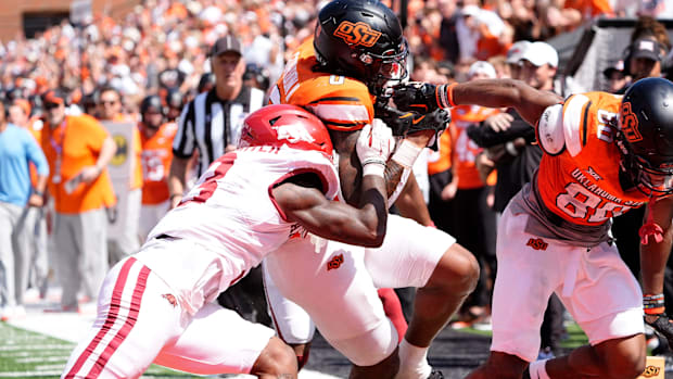 Oklahoma State's Ollie Gordon II scores a touchdown in double overtime against Arkansas.