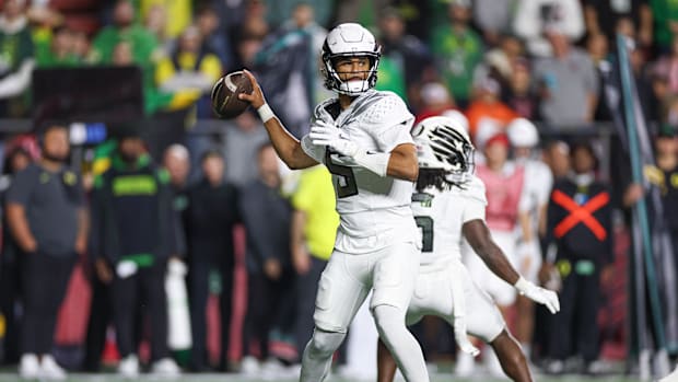 Oregon Ducks Dante Moore NFL Draft Mock Dan Lanning NIL Nike Phil Knight College Football Playoff Dolphins Browns Heisman