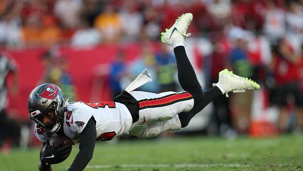 Oct 12, 2025; Tampa, Florida, USA; Tampa Bay Buccaneers wide receiver Tez Johnson (15) dives for a touchdown during the third