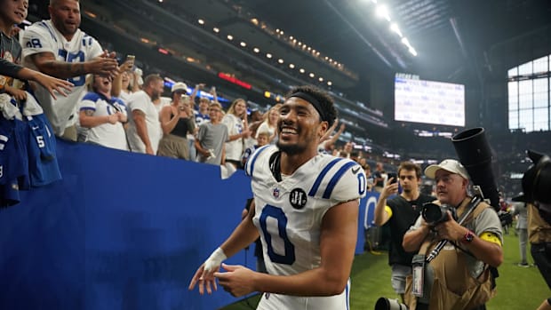 Colts safety Cam Bynum (White and Blue Uniform) Running through the tunnel. 