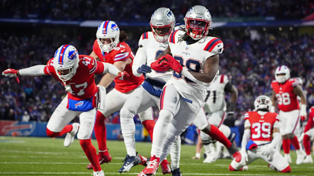 New England Patriots running back Rhamondre Stevenson (38) runs with the ball for a touchdown.
