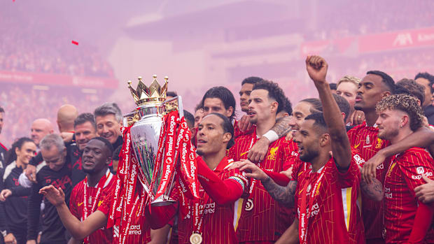 Liverpool’s players celebrate their Premier League title win.