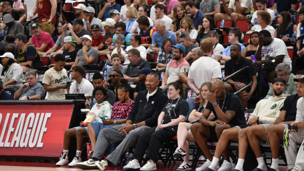 Former Michigan coach and NBA player Juwan Howard watches his son Jett play for the Orlando Magic on Friday. 