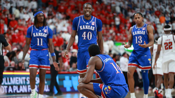 Kansas basketball players Jamari McDowell (11), Flory Bidunga (40), Melvin Council Jr. (14), and Elmarko Jackson (13)