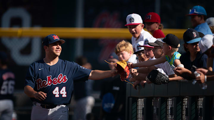 Current Cleveland Guardians prospect Dylan DeLucia greets fans at the 2022 NCAA Division I Men's Baseball Championship.