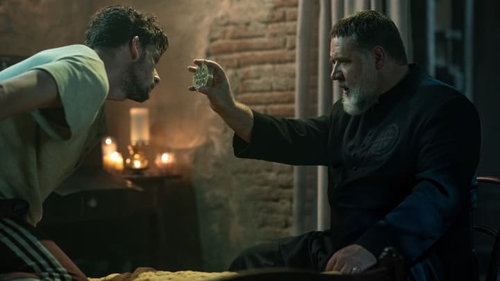 Father Gabriele Amorth (Russell Crowe, right) in Screen Gems’ THE POPE’S EXORCIST.