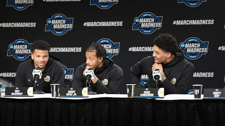 Mar 26, 2026; Chicago, IL, USA; L-R Michigan Wolverines guard Trey McKenney (1), guard Roddy Gayle Jr. (11) and forward Yaxel Lendeborg (23) during a press conference ahead of the midwest regional of the men's 2026 NCAA Tournament at United Center. Mandatory Credit: David Banks-Imagn Images