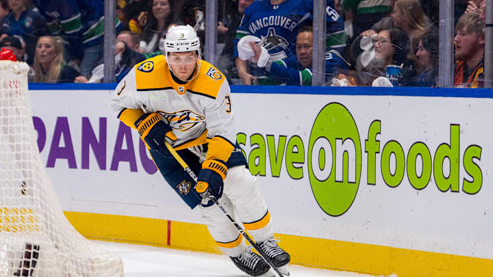 Apr 21, 2024; Vancouver, British Columbia, CAN; Nashville Predators defenseman Jeremy Lauzon (3) handles the puck against the Vancouver Canucks during the third period in game one of the first round of the 2024 Stanley Cup Playoffs at Rogers Arena. Canucks won 4 - 2. Mandatory Credit: Bob Frid-Imagn Images