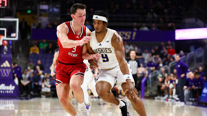 Dec 13, 2025; Seattle, Washington, USA; Washington Huskies guard Wesley Yates III (9) drives the ball while defended by Southern Utah Thunderbirds guard Tanner Hayhurst (3) in the first half at Alaska Airlines Arena at Hec Edmundson Pavilion. Mandatory Credit: Kevin Ng-Imagn Images