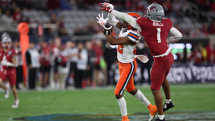 Dec 27, 2024; San Diego, CA, USA; Washington State Cougars defensive back Stephen Hall (1) deflects the ball from Syracuse Orange wide receiver Darrell Gill Jr. (82) during the first quarter at Snapdragon Stadium. Mandatory Credit: Abe Arredondo-Imagn Images