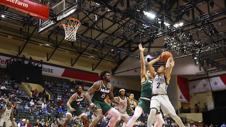 Nov 28, 2025; Kissimmee, FL, USA; Georgetown Hoyas guard Malik Mack (2) looks to hoot the ball against the Miami (FL) Hurricanes in the first half  during the ESPN Events Invitational at State Farm Field House. Mandatory Credit: Nathan Ray Seebeck-Imagn Images