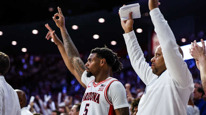 Nov 22, 2024; Tucson, Arizona, USA; Arizona Wildcats guard KJ Lewis (5) holds up the number three to celebrate a three pointer made against the Duke Blue Devils during the second half at McKale Center. Mandatory Credit: Aryanna Frank-Imagn Images