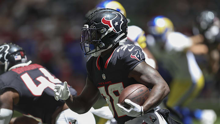 Aug 24, 2024; Houston, Texas, USA; Houston Texans running back J.J. Taylor (38) in action during the game against the Los Angeles Rams at NRG Stadium. Mandatory Credit: Troy Taormina-Imagn Images