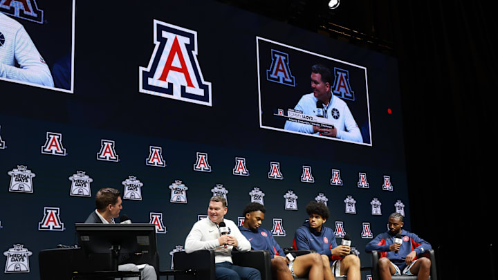 Oct 22, 2025; Kansas City, MO, USA; Arizona head coach Tommy Lloyd and players Tobe Awaka, Koa Peat and Jaden Bradley speaks to media during Big 12 Menís Basketball media day at T-Mobile Center. Mandatory Credit: Sophia Scheller-Imagn Images