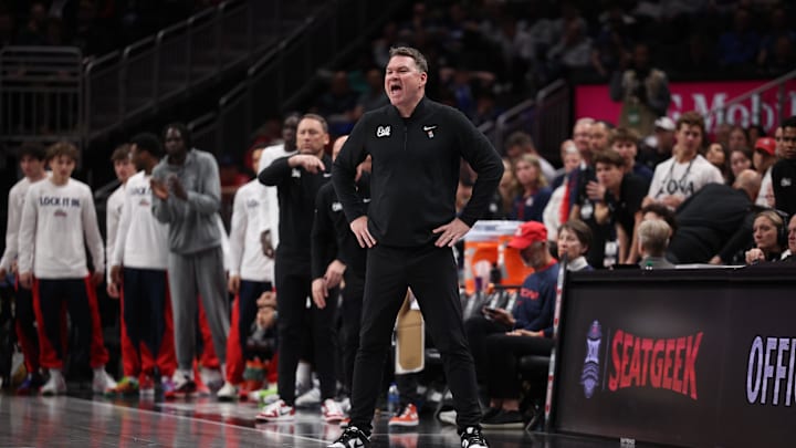 Mar 14, 2026; Kansas City, MO, USA; Arizona Wildcats head coach Tommy Lloyd stands on the sideline during the second half against the Houston Cougars during the men's Big 12 Conference Tournament Championship at T-Mobile Center. Mandatory Credit: William Purnell-Imagn Images