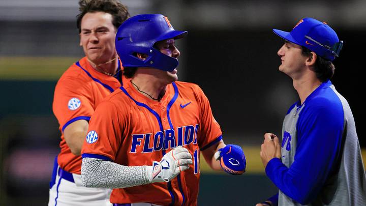 Florida infielder Brendan Lawson (11) reacts to scoring during the ninth inning of an NCAA college baseball matchup Tuesday, March 25, 2025 at VyStar Ballpark in Jacksonville, Fla. 