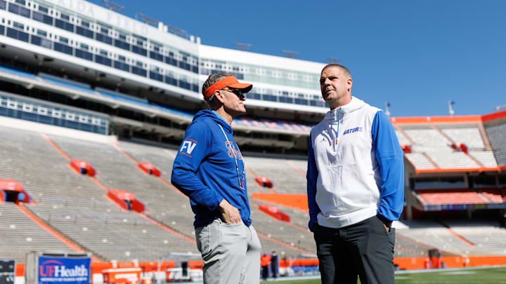 Apr 12, 2025; Gainesville, FL, USA; Florida Gators athletic director Scott Stricklin and Florida Gators head coach Billy Napier talk before the game at Ben Hill Griffin Stadium. Mandatory Credit: Matt Pendleton-Imagn Images