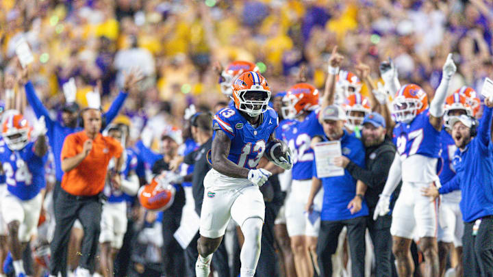 Sep 13, 2025; Baton Rouge, Louisiana, USA;  Florida Gators running back Jadan Baugh (13) catches a pass for a touchdown against the LSU Tigers that was called back for a penalty during the first half at Tiger Stadium. Mandatory Credit: Stephen Lew-Imagn Images