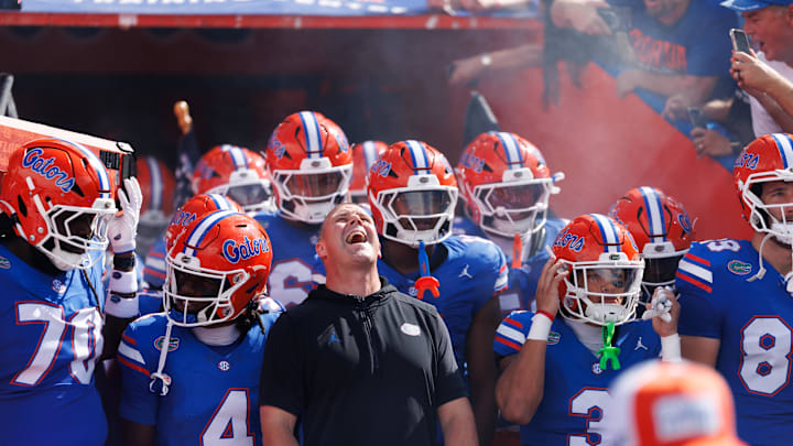 Sep 6, 2025; Gainesville, Florida, USA; Florida Gators head coach Billy Napier screams while surrounded by his team before a game against the South Florida Bulls at Ben Hill Griffin Stadium. Mandatory Credit: Matt Pendleton-Imagn Images