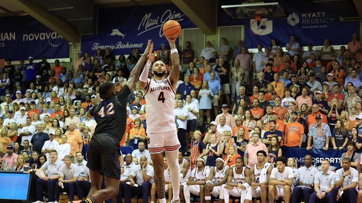 Nov 27, 2024; Lahaina, Hawaii, USA;  Auburn Tigers forward Johni Broome (4) shoots over Memphis Tigers forward Dain Dainja (42) in the second half in Lahaina Civic Center. Mandatory Credit: Marco Garcia-Imagn Images