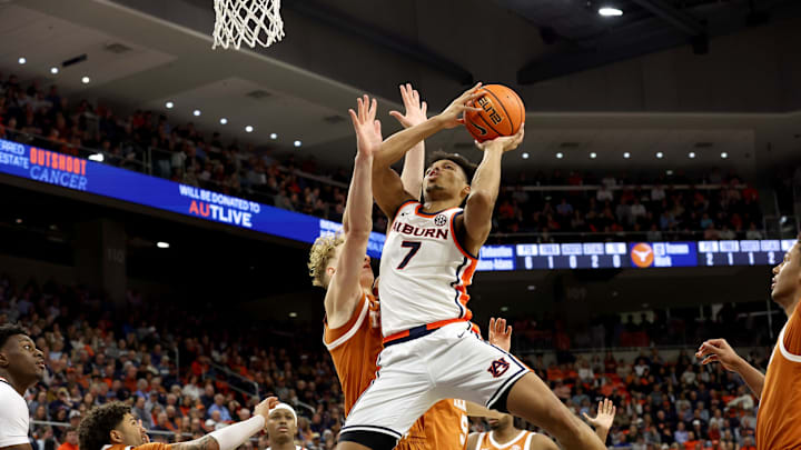 Jan 28, 2026; Auburn, Alabama, USA;  Auburn Tigers guard Keyshawn Hall (7) goes up for a shot against Texas Longhorns center Matas Vokietaitis (8) during the second half at Neville Arena.  Hall scored 31 points as Auburn beat Texas 88-82. Mandatory Credit: John Reed-Imagn Images