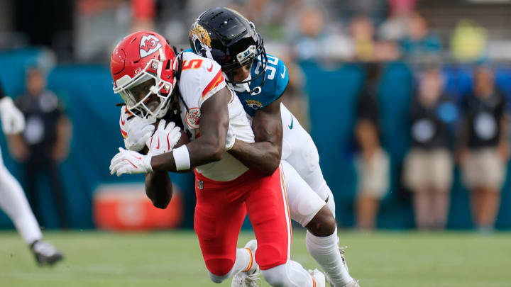 Jacksonville Jaguars cornerback Montaric Brown (30) tackles Kansas City Chiefs wide receiver Hollywood Brown (5) during the first quarter of a preseason NFL football game Saturday, Aug. 10, 2024 at EverBank Stadium in Jacksonville, Fla.