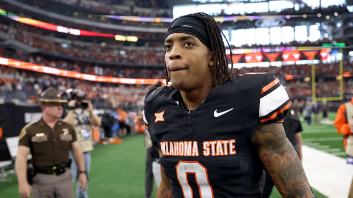 Oklahoma State's Ollie Gordon II (0) walks of the field following the Big 12 Football Championship game between the Oklahoma State University Cowboys and the Texas Longhorns at the AT&T Stadium in Arlington, Texas, Saturday, Dec. 2, 2023.