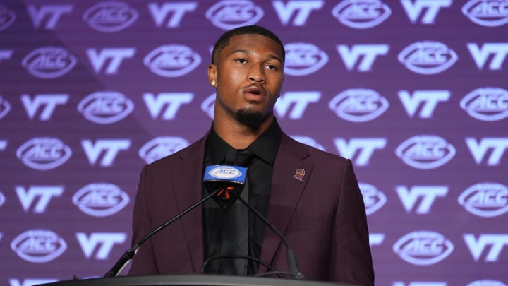 Jul 23, 2024; Charlotte, NC, USA; Virginia Tech quarterback Kyron Drones answers questions from the media during the ACC Kickoff at Hilton Charlotte Uptown. Mandatory Credit: Jim Dedmon-USA TODAY Sports