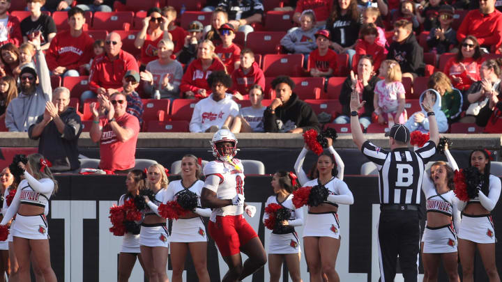 Louisville’s Chris Bell celebrates scoring a touchdown against Louisville’s defense. 
April 19, 2024