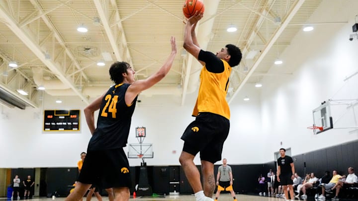 Iowa’s Kael Combs (11) shoots over Tate Sage (24) during practice June 19, 2025 at Carver-Hawkeye Arena in Iowa City, Iowa.