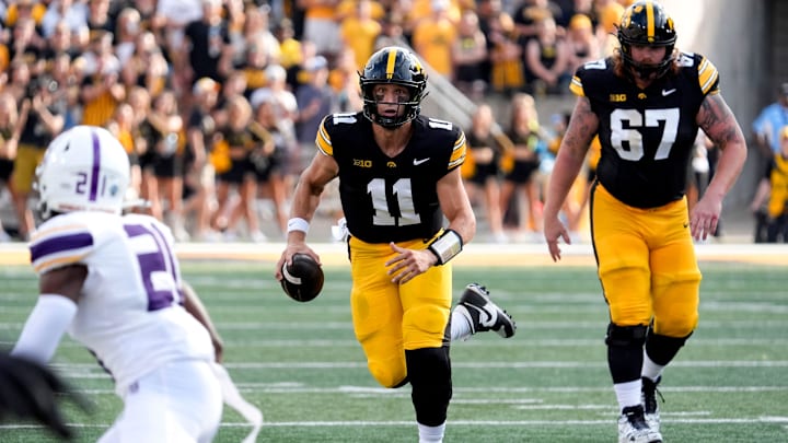 Iowa Hawkeyes quarterback Mark Gronowski (11) scrambles against the Albany Great Danes Aug. 30, 2025 at Kinnick Stadium in Iowa City, Iowa.