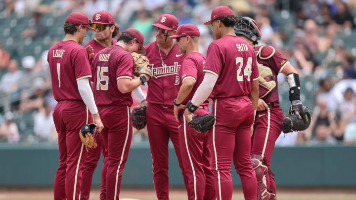 May 25, 2024; Charlotte, NC, USA; Florida State head coach Link Jarrett relieves Florida State pitcher Connor Hults (15) in the sixth inning against Wake Forest during the ACC Baseball Tournament at Truist Field. Mandatory Credit: Cory Knowlton-USA TODAY Sports