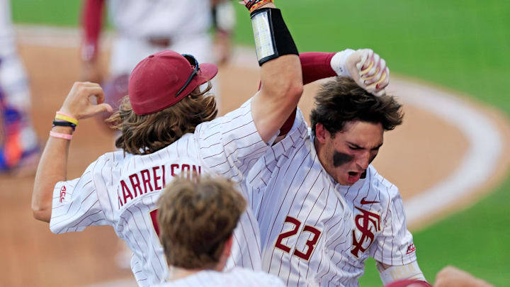 Florida St. outfielder Brody DeLamielleure (23) celebrates his two-run home run with outfielder Gage Harrelson (9) during the fourth inning of an NCAA college baseball matchup Tuesday, March 25, 2025 at VyStar Ballpark in Jacksonville, Fla. FSU rallied to defeat UF 8-4 off a walk-off grand slam from Alex Lodise in the ninth inning. [Corey Perrine/Florida Times-Union]